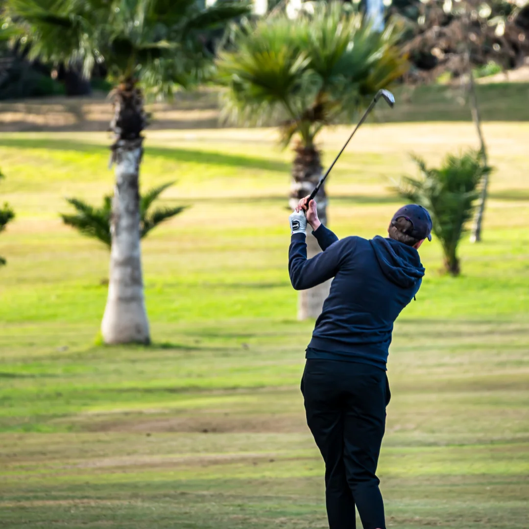 golf player swinging at the Marsa Sports Club